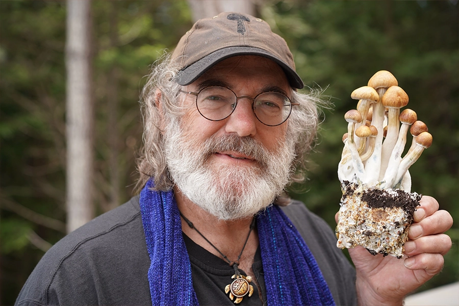 Paul Stamets holding up mushrooms